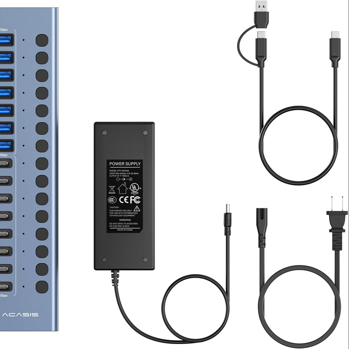 Collection of USB hub, power supply, and cables on a white background